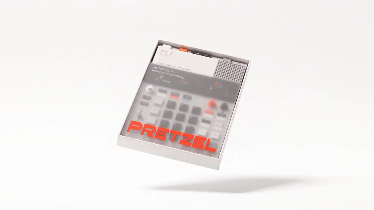 Pretzel goodies floating on a white set in frosted boxes, tins and bags printed with the orange Pretzel wordmark